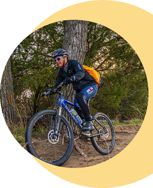 A man riding through a bike trail.