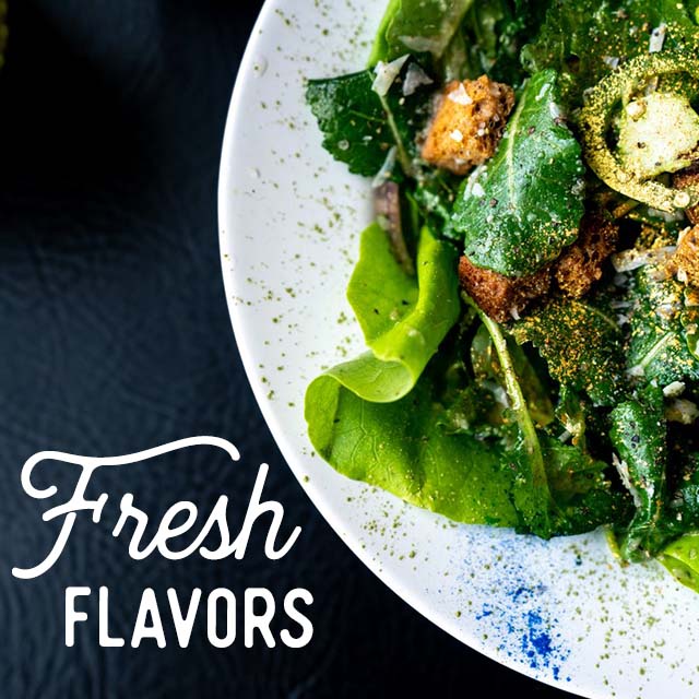 Fresh Flavors - Close-up of a plate with salad greens.