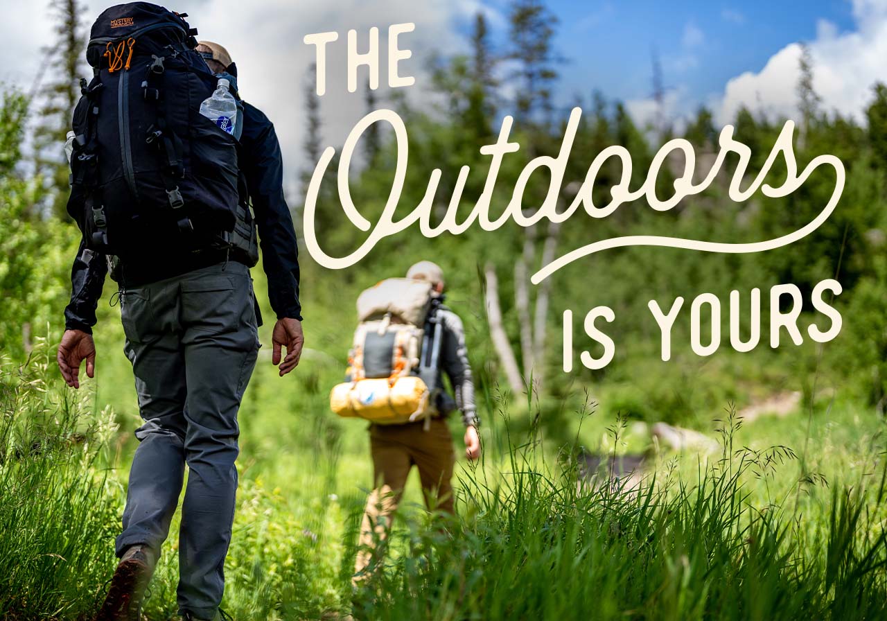Two people hiking on a nature trail. A headline reads: The Outdoors is yours.