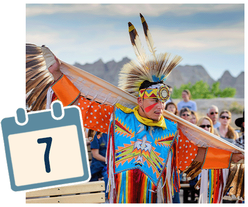 A native with a headdress participating in a ceremony.