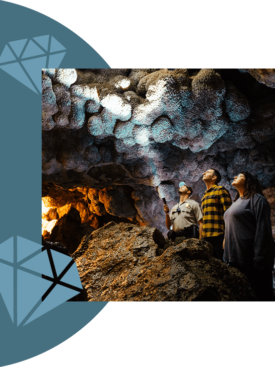 A group of people exploring a cavern.