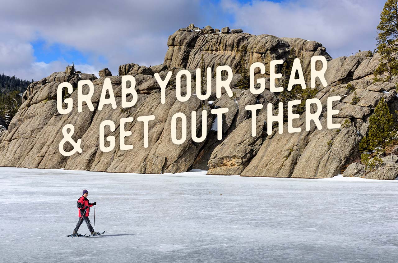 An aerial view of someone out hiking. A headline reads: Grab Your Gear&Get Out There