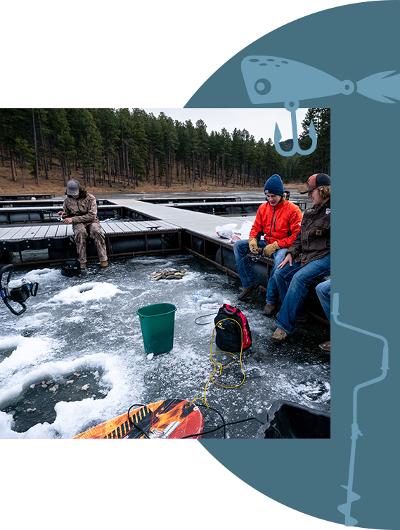 A group of men sitting on a dock, ice fishing.